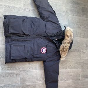 This is a Canada goose man down coat size medium color navy